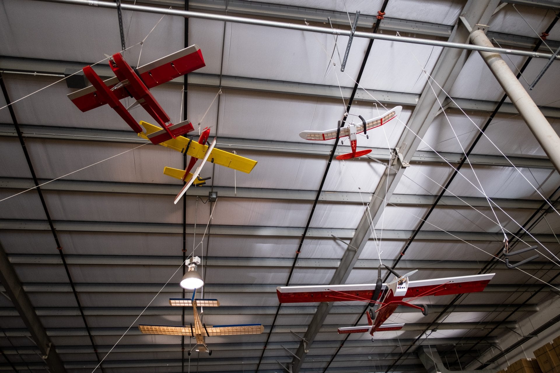 Model Airplanes in the rafters of a Large Warehouse Distribution Center