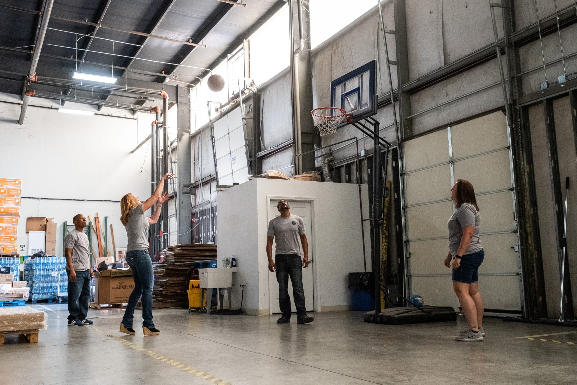 Employees playing Basketball during break at Large Warehouse Distribution Center Nashville TN ready to complete kitting, pick and pack, and cross docking services